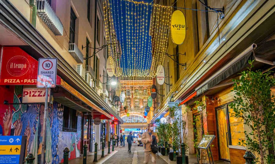 A laneway lit up with hanging fairy lights