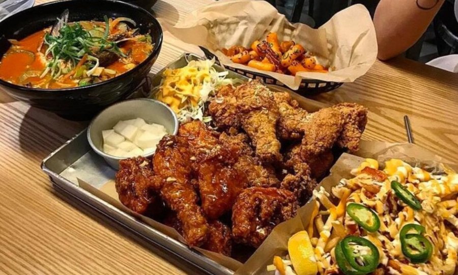
Platter with chicken, salads and dips.
