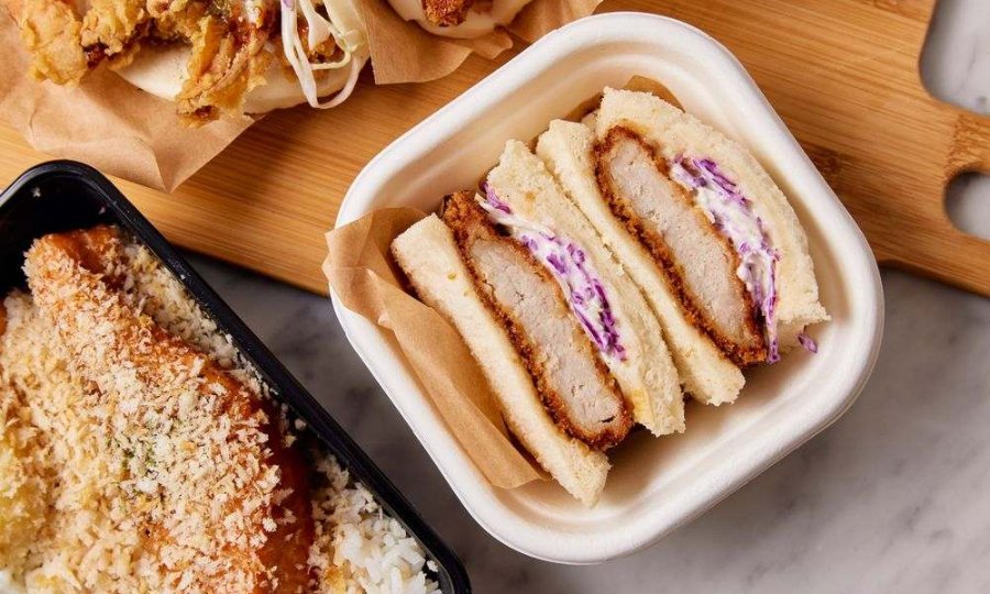 A chicken sandwich in a container