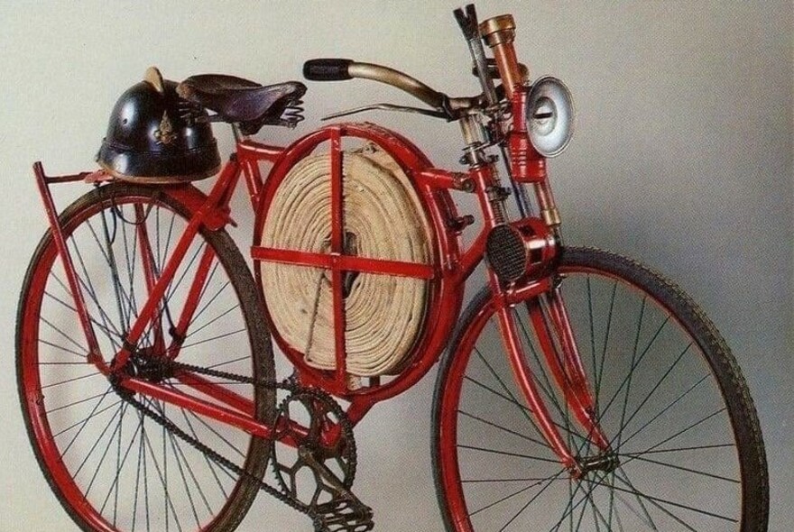 Fireman's hose mounted on a bicycle.