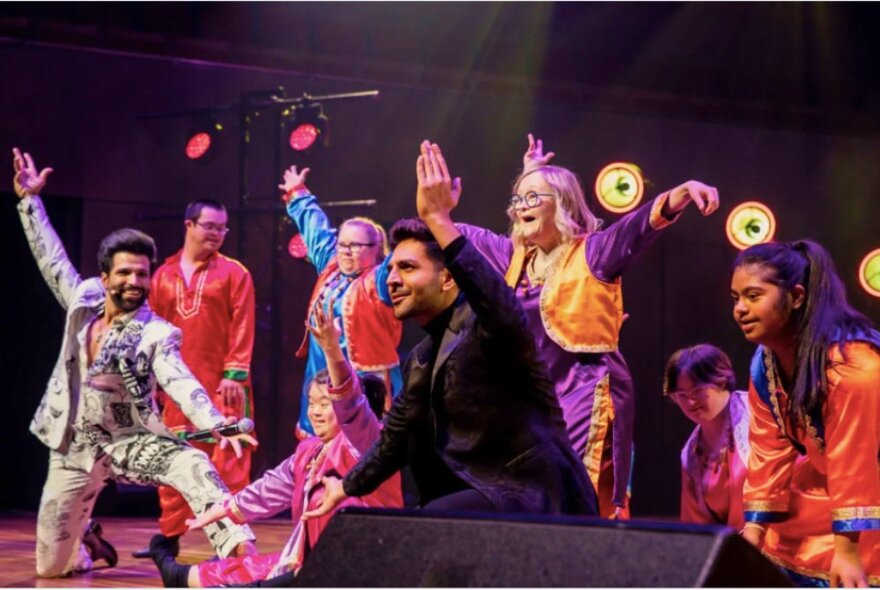 People on stage performing a dance at the Indian Film Festival Awards Night.