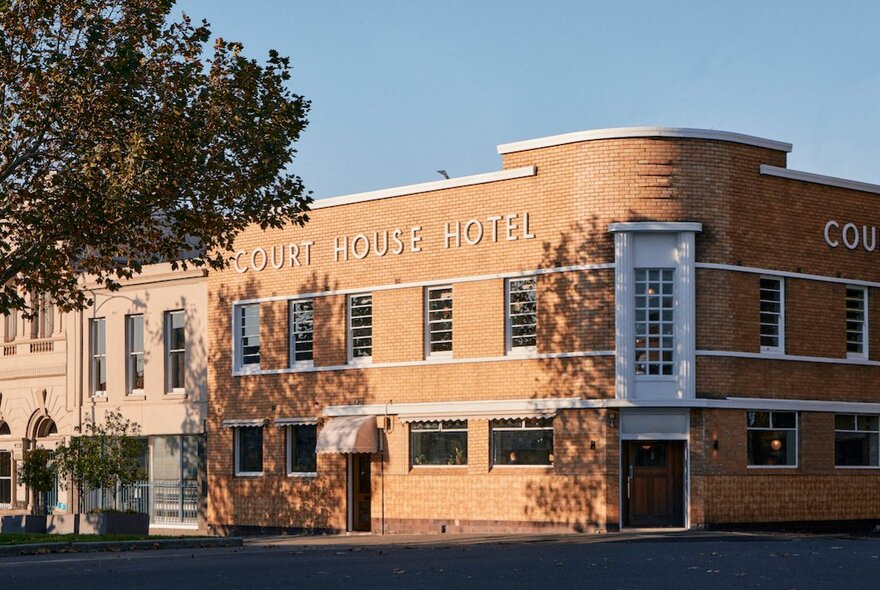 The light brick exterior of the Courthouse Hotel in North Melbourne. 