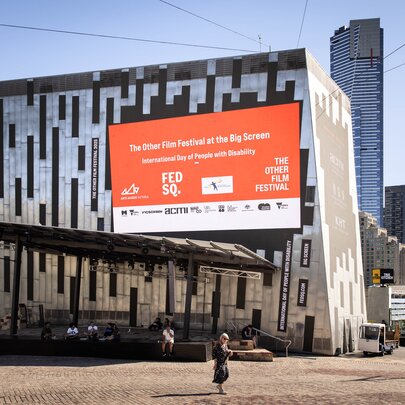 The Big Screen at Federation Square with an orange ad showing. 