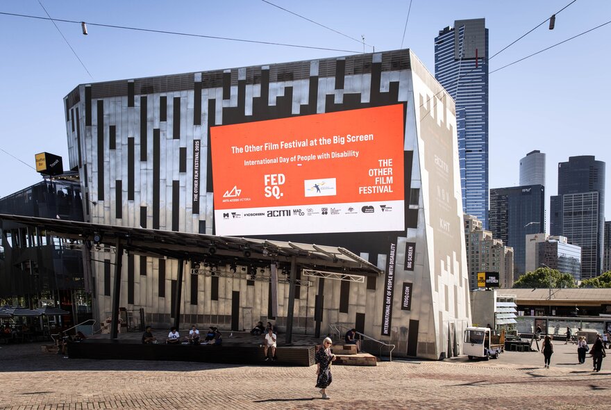 The Big Screen at Federation Square with an orange ad showing. 