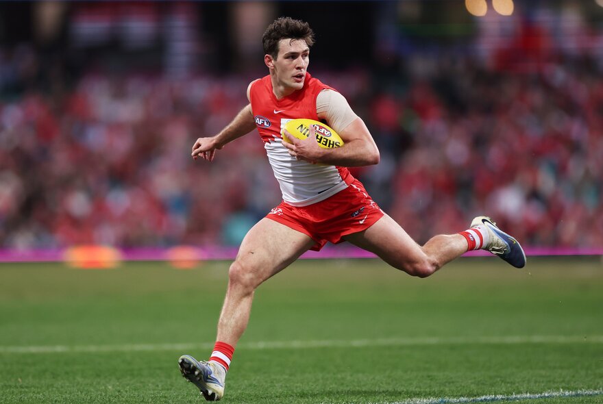 Sydney Swans AFL football player on the field during a match.