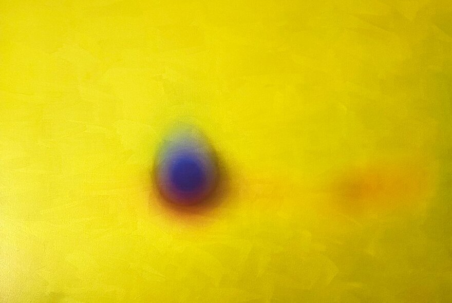 Contemporary oil painting of a central blueish spherical shape against a shimmering yellow background.