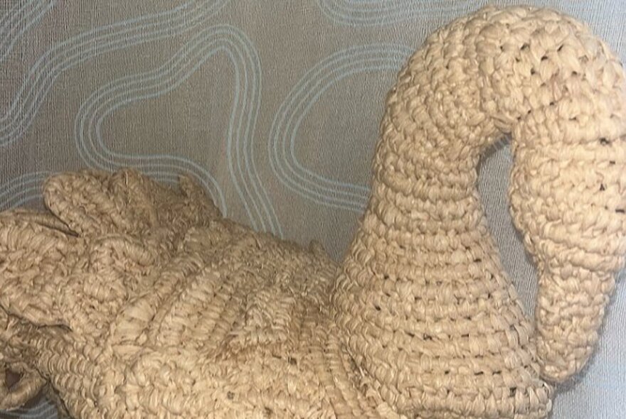 A figure of a swan, woven out of natural fibres.