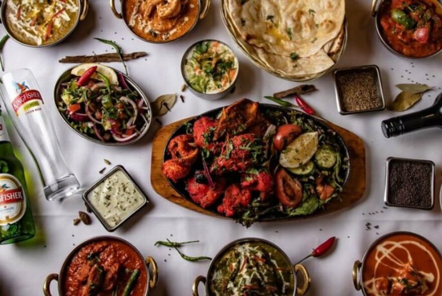 Selection of Indian dishes on a restaurant table.