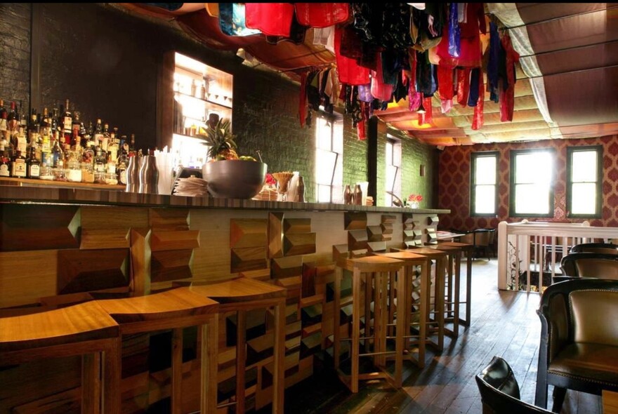 Seamstress bar with a row of bar stools.