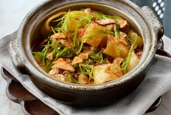  A bowl of pasta with greens.