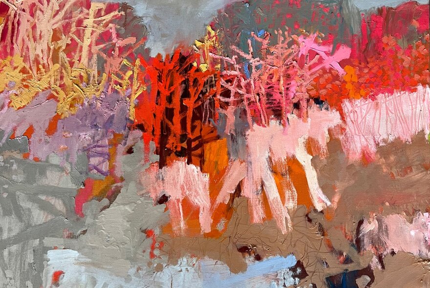 Abstract artwork of flowers in reds and pinks.