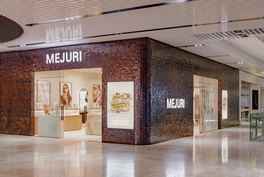 The exterior of jewellery store Mejuri in a shopping centre on a corner. 