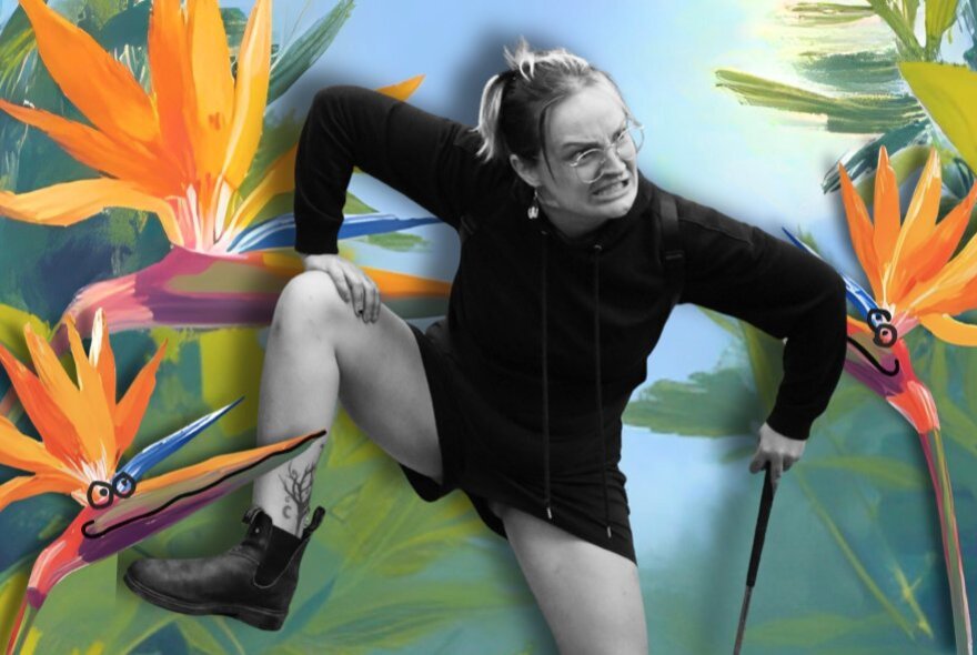 Woman with legs and arms raised, surrounded by bird of paradise flowers.