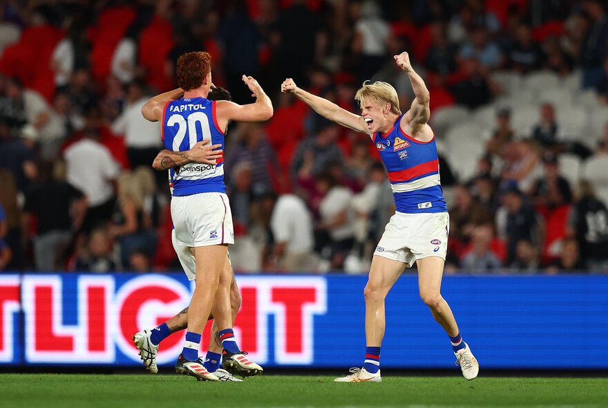Western Bulldog AFL football players on the field during a match.