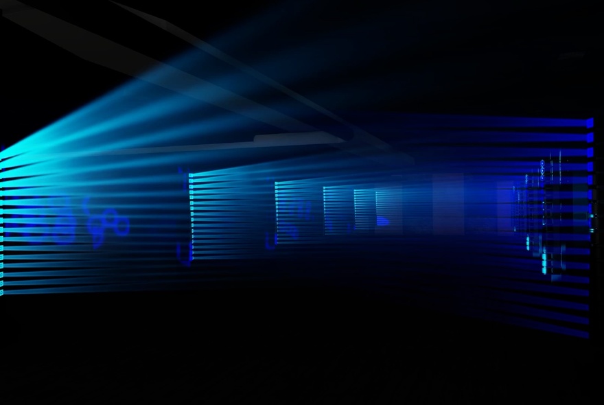 A light show experience showing a cast of aqua light beaming from the left of the picture.