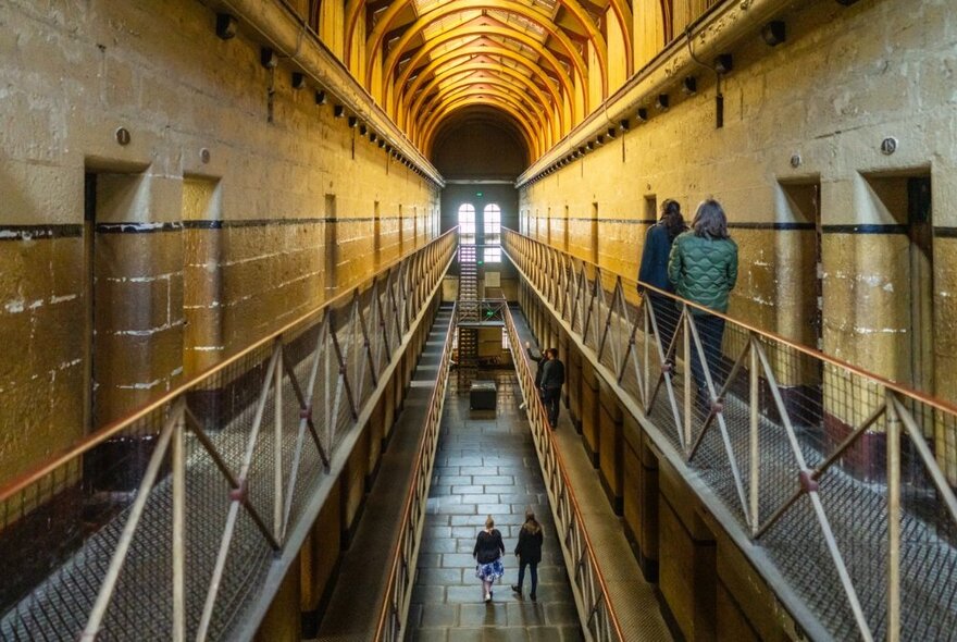 Inside the Old Melbourne Gaol looking at the cell corridors and down to the level below. 