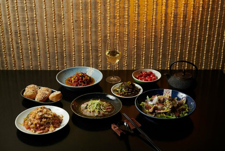 A table set with a Chinese banquet.