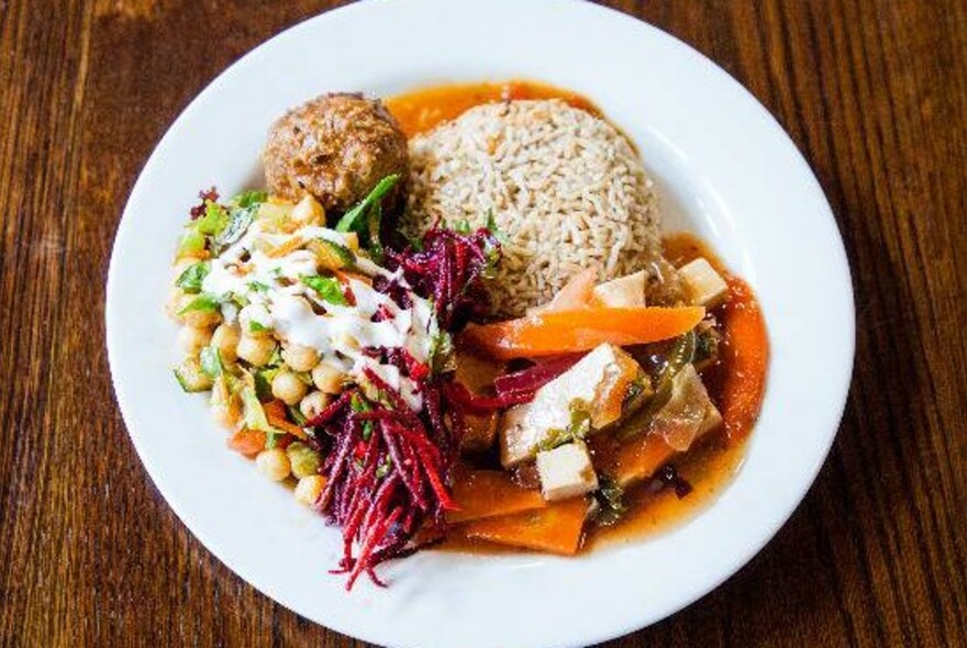 Vegetarian meal of chickpeas, beetroot salad and rice.