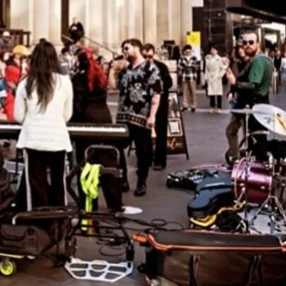 Street performers setting up with their instruments on Bourke Street Mall in Melbourne.