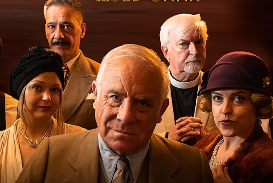 Five people dressed as characters in a play in 1930s style clothing.