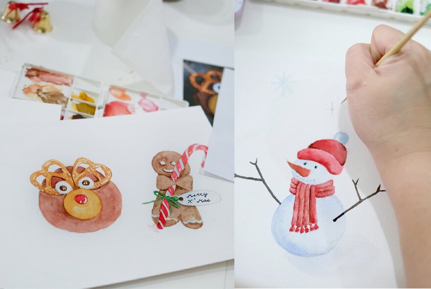 A hand painting festive images with watercolour paint on white paper.
