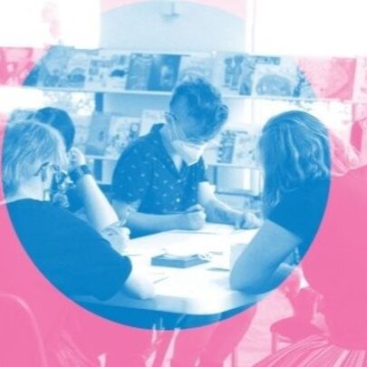 Photo with a pink and blue colour overlay shows people gathered around a table in a writing workshop.
