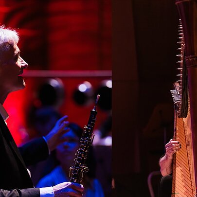 Traditional musicians with harp and clarinet.