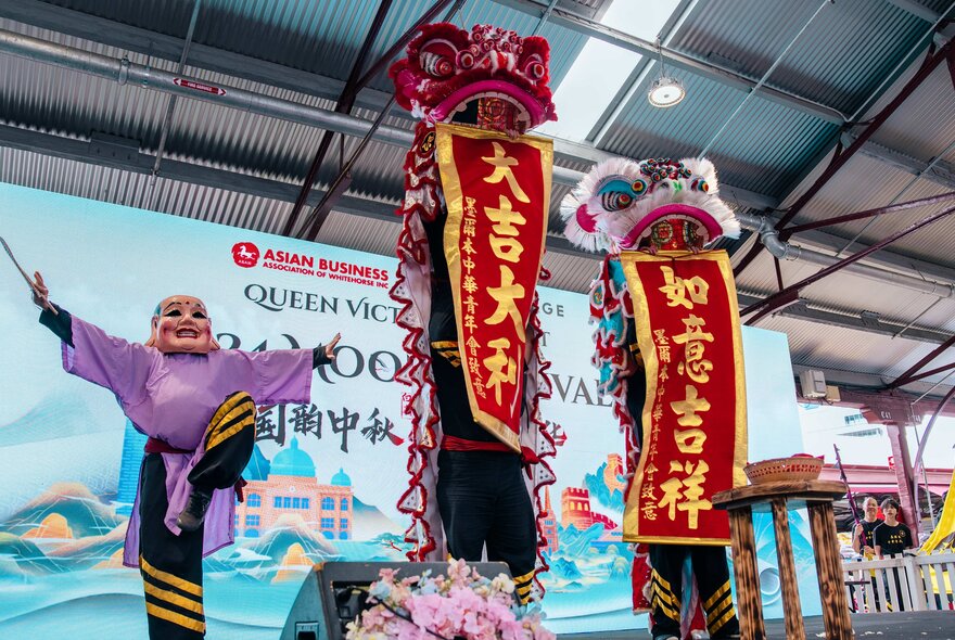 A cultural performance on a small stage at the Moon Festival at Queen Victoria Market.