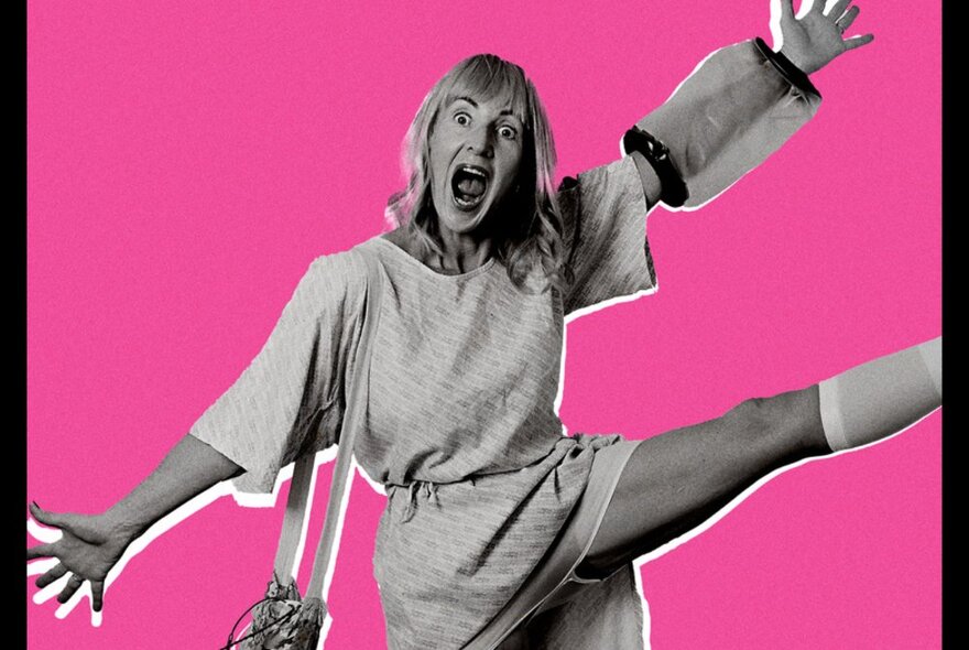 A woman wearing a hospital gown, with her arms stretched out either side of her torso, her mouth wide open as if surprised, and kicking one of her legs into the air; against a hot pink background.