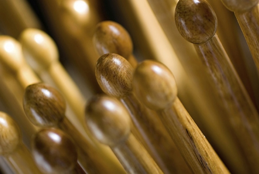 Close up of drumsticks in different coloured woods.