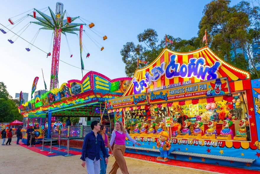 A group of friends are at a carnival.