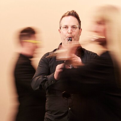 Blurred classical musicians playing their instruments.