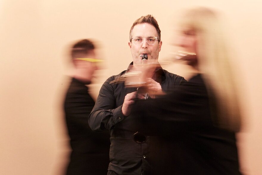 Blurred classical musicians playing their instruments.