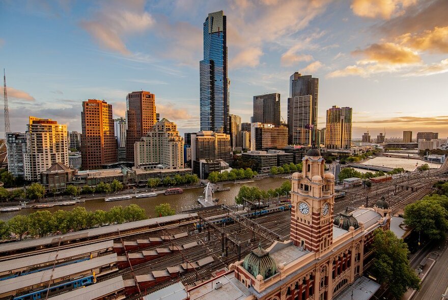 Views over Flinders Street Station, the river and city buildings.