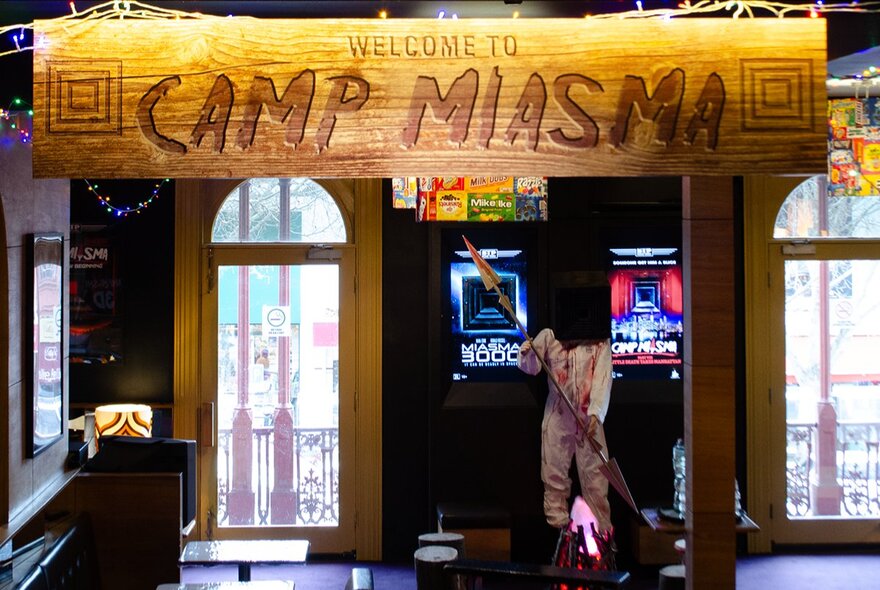 Camp Miasma bar theme sign and props.