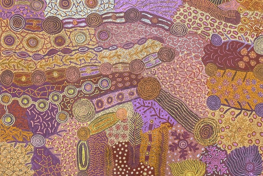 An Indigenous art work, comprised of dots, stripes and circular shapes in brown, purple and yellow tones.