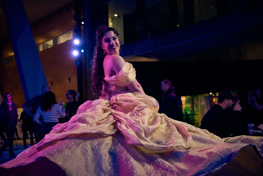 A woman in a Belle costume.