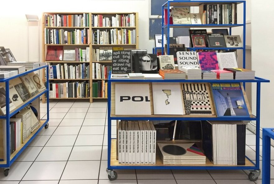 Bright book store with blue shelving