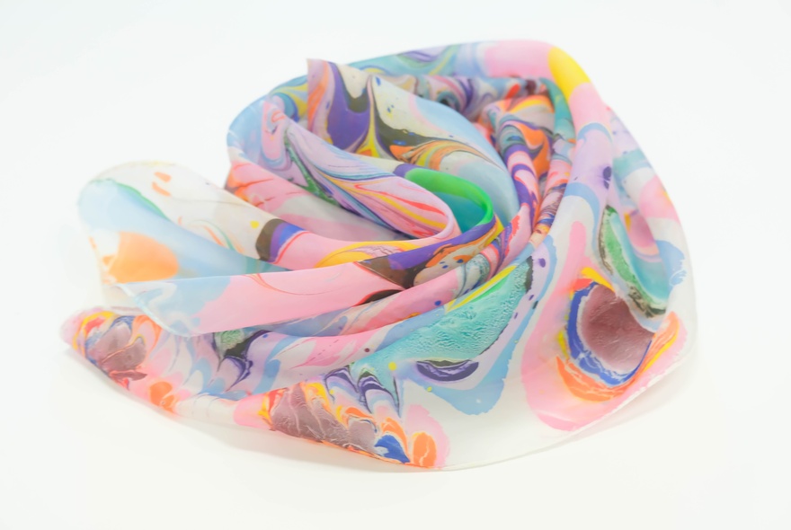 A scarf made from water-marbled silk.