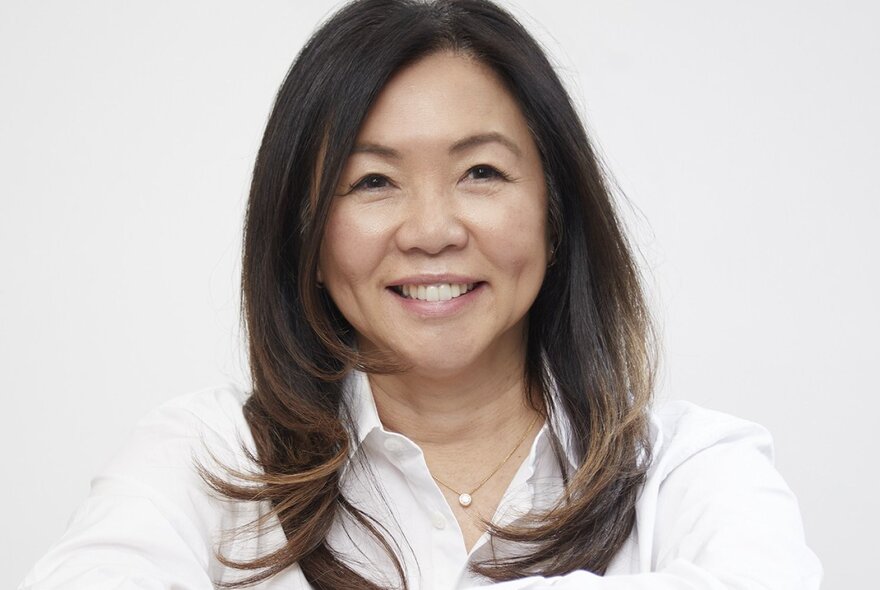 Baker Helen Goh smiling, wearing white shirt.