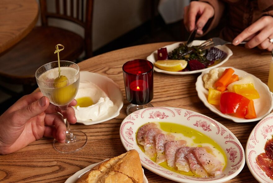 Plates of Greek food on a table.