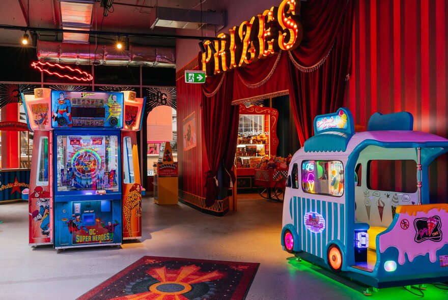 Brightly coloured interior of Archie Brothers games venue with a retro arcade game in background.
