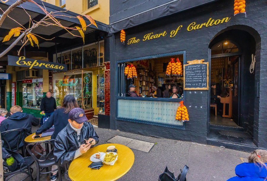 People sitting in front of a cafe