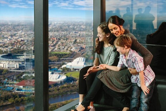 A family enjoying the 88th floor panoramic views of Melbourne from Melbourne Skydeck.