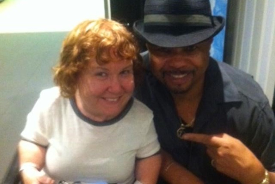 Two people smiling at the camera.