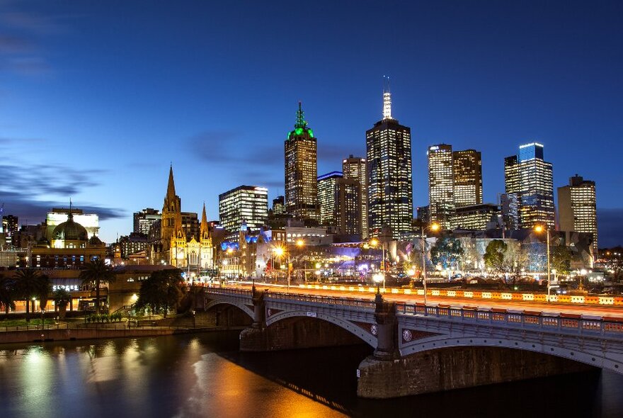 The Melbourne city skyline taken from the Yarra River at dusk. 