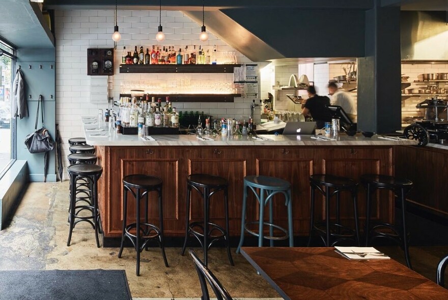 Bar, bar stools and tables at Tipo 00 restaurant.