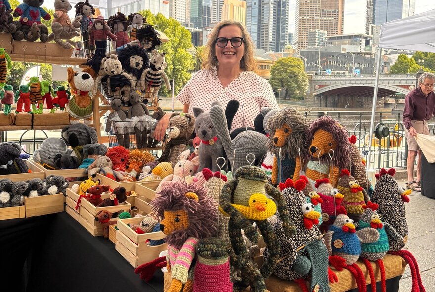 Market stallholder with her puppet toys, beside the Yarra River in the CBD.