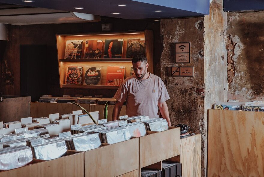 A man browsing records in a store.