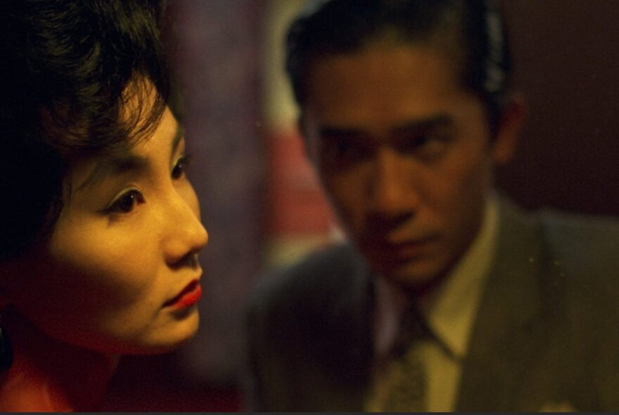 The faces of Tony Leung Chiu Wai and Maggie Cheung Man Yuk, in a still from the movie In the Mood for Love